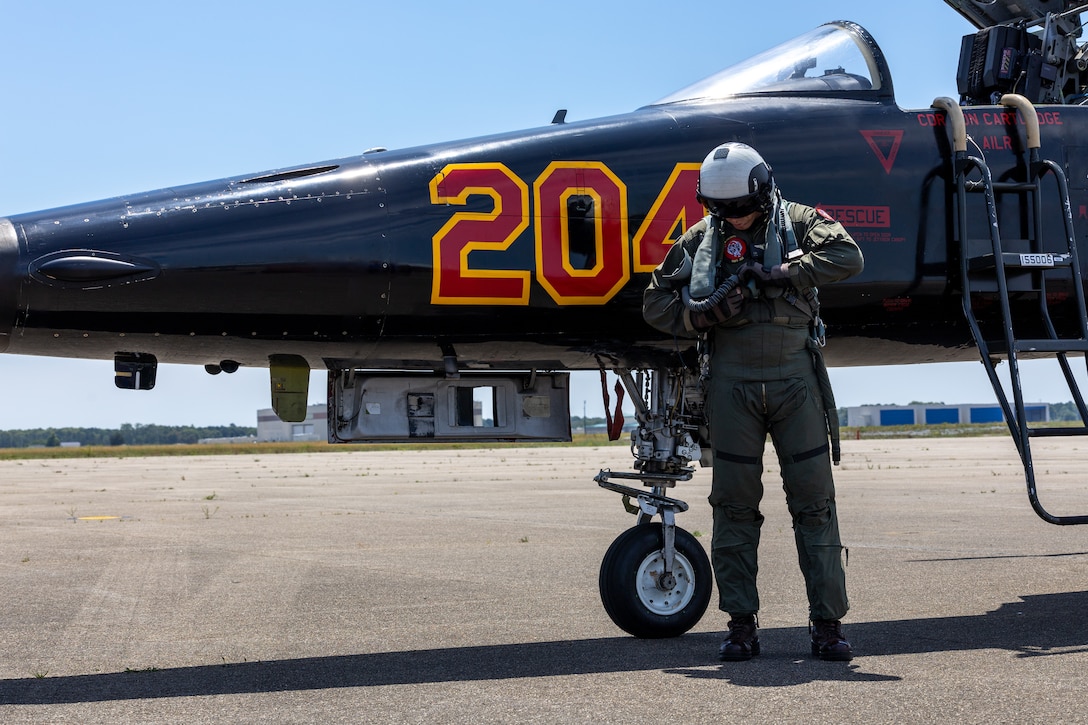 U.S. Marine Corps Maj. Erin Mathis, an operation officer with Marine Fighter Training Squadron (VMFT) 402, Marine Aircraft Group 41, 4th Marine Aircraft Wing, steps off an F-5N Tiger II aircraft during Atlantic Alliance 2025 at Joint Base Cape Cod, Massachusetts, July 3, 2025. VMFT-402’s purpose in Atlantic Alliance is to support and enhance Navy-Marine Corps amphibious operations by providing advanced fighter training and integrating air combat capabilities into joint and allied exercises along the East Coast. (U.S. Marine Corps photo by Sgt. Emely Gonzalez)