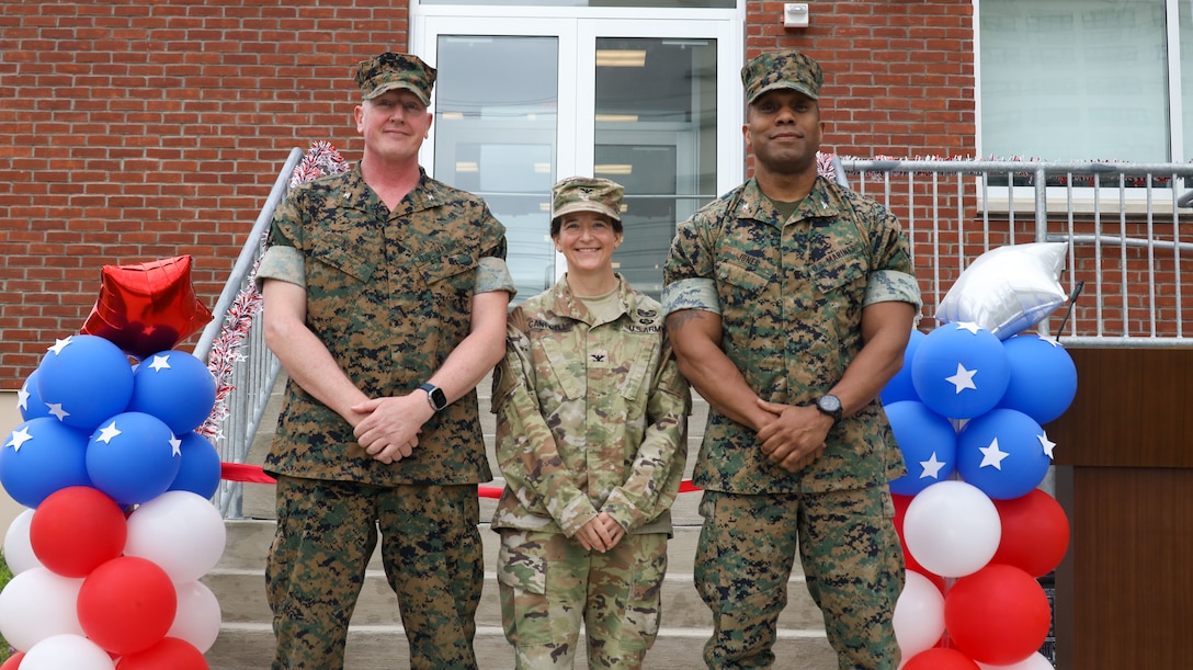 U.S. Marine Corps Col. Charles Nicol (left), commading officer of 1st Marine Corps District (MCD), U.S. Army Col. Melissa Cantwell (center), commanding officer of Fort Hamilton, and Col. Robert Jones (right), incoming commanding officer of 1st MCD, pose for photo during the opening ceremony of the Robert Mullan Center, Fort Hamilton, New York, July 17, 2025. The ceremony was held to honor the opening of 1st Marine Corps District’s new headquarters after relocating from Garden City, New York.