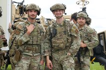 (From left to right) Airman 1st Class Justin Hampton Airman 1st Class Benjamin Eickhoff and Senior Airman George Torres of the 91st Missile Security Operations Squadron defenders pose for a picture at Minot Air Force Base, North Dakota, July 11, 2025. The Airmen served as a part of the convoy during the Bully Vigilance 25-1 exercise, used to prepare defenders for any outside threats.