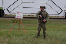 Senior Airman Drake Bruns, 91st Missile Security Operations Squadron defender guards the National Defense Area on Minot Air Force Base, North Dakota, July 11, 2025. Bruns guarded a convoy during the Bully Vigilance 25-1 exercise. Exercises like this allow Airmen to demonstrate their skills under the stress of a combat environment.