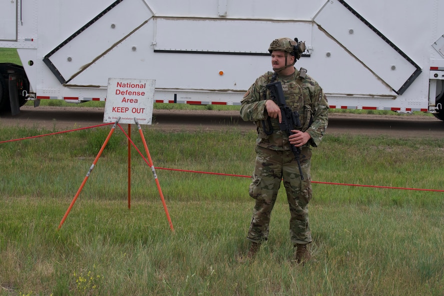 Senior Airman Drake Bruns, 91st Missile Security Operations Squadron defender guards the National Defense Area on Minot Air Force Base, North Dakota, July 11, 2025. Bruns guarded a convoy during the Bully Vigilance 25-1 exercise. Exercises like this allow Airmen to demonstrate their skills under the stress of a combat environment.
