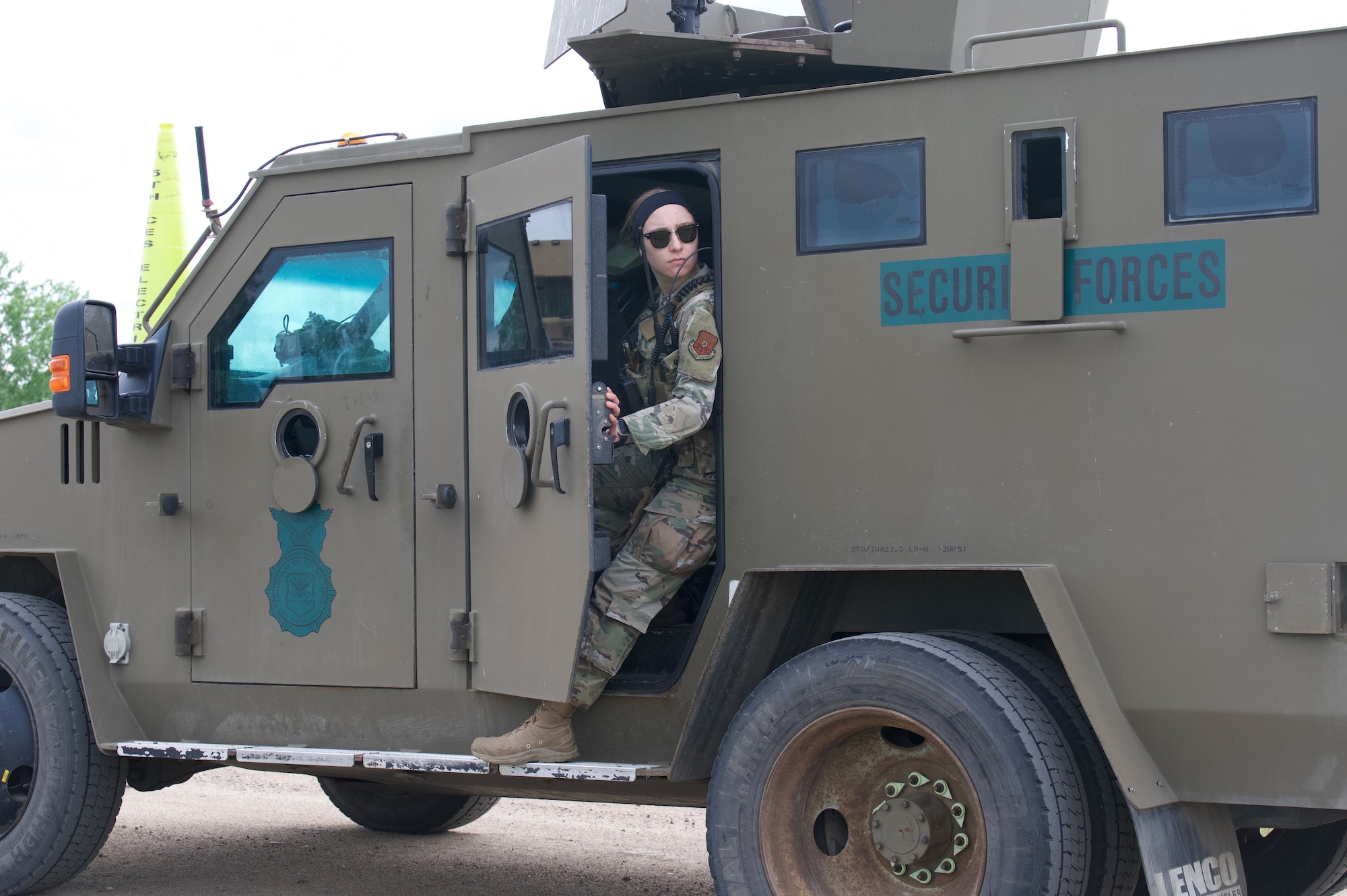 Airman 1st Class Abigail Goodner, 91st Missile Security Operations Squadron defender, checks her surroundings on Minot Air Force Base, North Dakota July 11, 2025. Goodner served as a member of the fire observers during the Bully Vigilance 25-1, an exercise designed to demonstrate the proficiency of defenders during a convoy.