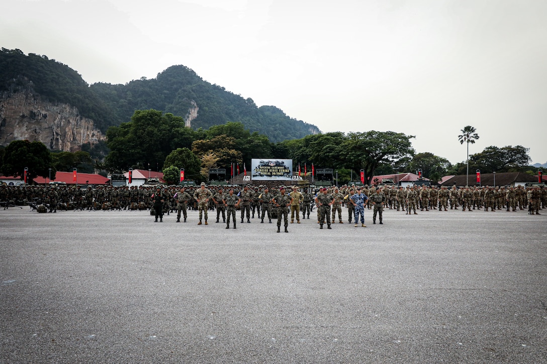 Multinational forces from the Malaysian Armed Forces, U.S. Army, and Australian Defence Force stand in formation during the opening ceremony