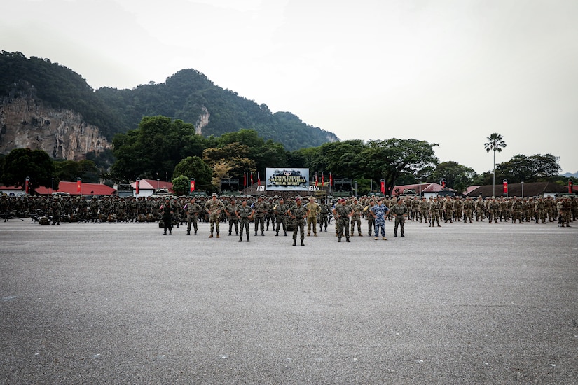 Multinational forces from the Malaysian Armed Forces, U.S. Army, and Australian Defence Force stand in formation during the opening ceremony