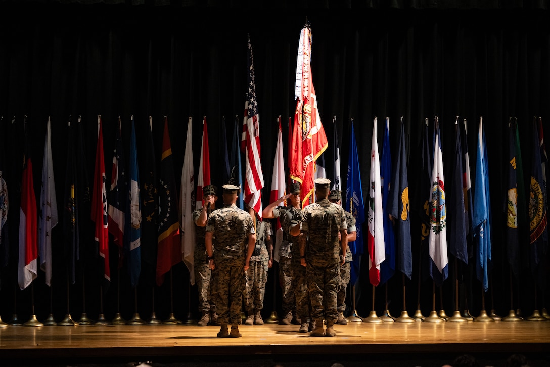 U.S. Marine Corps Col. Thomas Farrington II, left, incoming commanding officer, stands at attention next to Col. Garth W. Burnett, outgoing commanding officer, Marine Corps Air Station (MCAS) New River, during a change of command ceremony at MCAS New River in Jacksonville, North Carolina, July 17, 2025. The ceremony represented the transfer of responsibility, authority and accountability from the outgoing to the incoming commanding officer. (U.S. Marine Corps photo by Cpl. Loriann Dauscher)