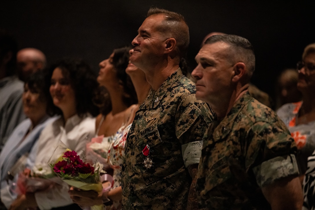 U.S. Marine Corps Brig. Gen Ralph J. Rizzo Jr., right, commanding general, Marine Corps Installations East-Marine Corps Base Camp Lejeune, and Col. Garth W. Burnett, outgoing commanding officer, Marine Corps Air Station (MCAS) New River, stand at the conclusion of a change of command ceremony at MCAS New River, in Jacksonville, North Carolina, July 17, 2025. The ceremony represented the transfer of responsibility, authority and accountability from the outgoing to the incoming commanding officer. (U.S. Marine Corps photo by Cpl. Loriann Dauscher)