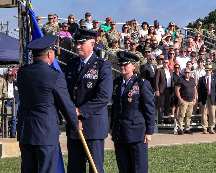 U.S. Air Force Maj. Gen. Matthew Davidson, 2nd Air Force commander, passes the guidon to Col. Matthew Norton, 17th TRW commander, upon assuming command during the change of command ceremony at Goodfellow Air Force Base, Texas, July 17, 2025. The mission of the 17th TRW is to train, transform and empower joint and coalition warriors. (U.S. Air Force photo by Senior Airman Evelyn D’Errico)