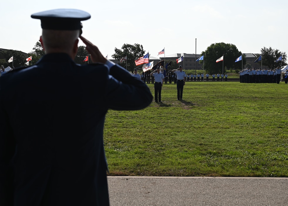 Members of the 17th Training Wing present U.S. Air Force Col. Matthew Norton his first official salute during the change of command ceremony at Goodfellow Air Force Base, Texas, July 17, 2025. The salute represents the squadron welcoming its new commander. (U.S. Air Force photo by Staff Sergeant Nathan Call)