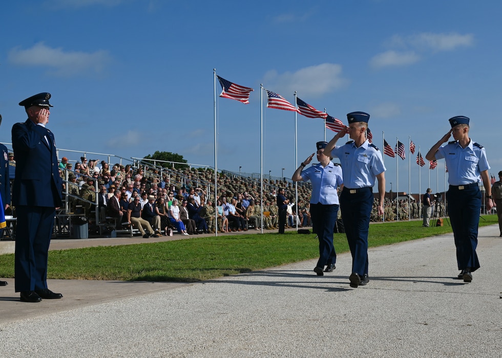 U.S. Air Force Colonel Thomas Wilson, 17th Training Wing deputy commander, salutes U.S. Air Force Col. Matthew Norton, 17th TRW commander, during the change of command ceremony at Goodfellow Air Force Base, Texas, July 17, 2025. The pass in review is a long standing military tradition dating back to when Baron Von Steuben arrived at Valley Forge and reported to Washington during the American Revolution in 1778. (U.S. Air Force photo by Staff Sergeant Nathan Call)