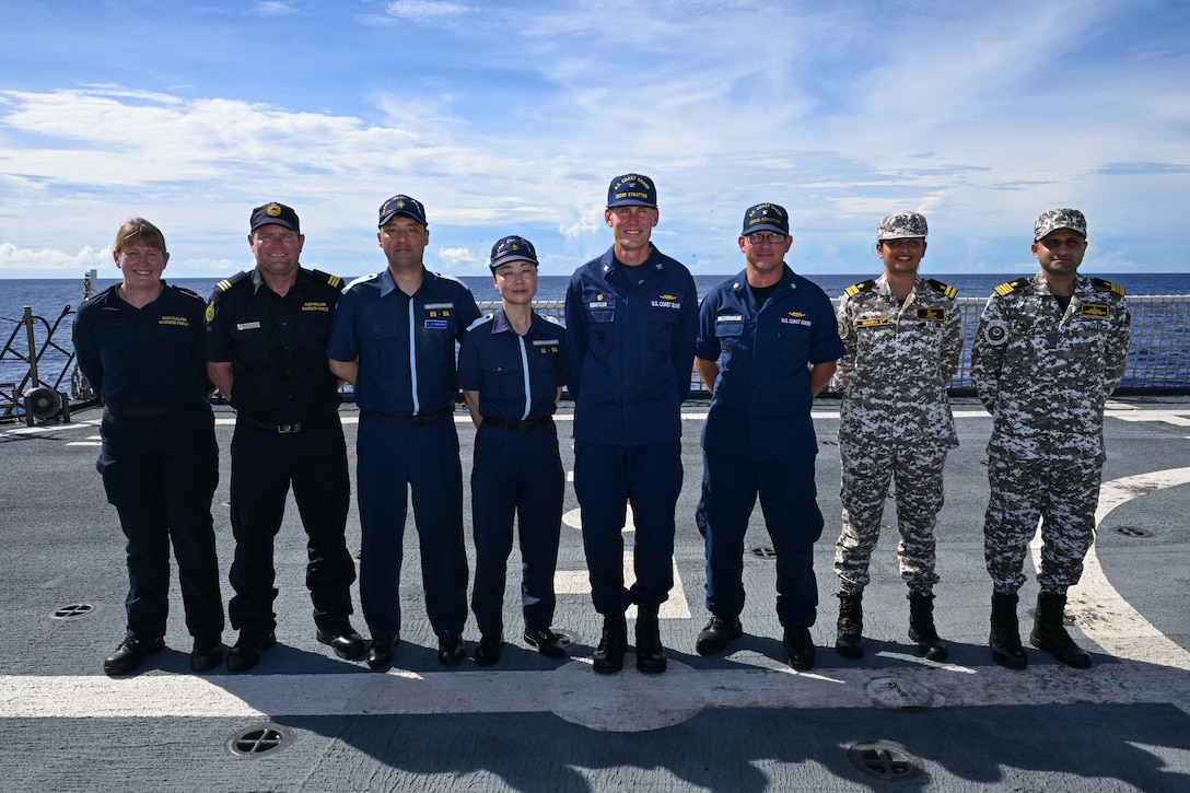 Quad partners from the U.S. Coast Guard, Japan Coast Guard, Australian Border Force and Indian Coast Guard take a group photo on the flight deck of Legend-class U.S. Coast Guard Cutter Stratton (WMSL 752) for the first Quad at-sea mission in the Pacific Ocean, July 1, 2025. Stratton is deployed and assigned to Destroyer Squadron (DESRON) 15, the Navy’s largest DESRON and the U.S. 7th Fleet’s principal surface force. Stratton is deployed to the Indo-Pacific to advance relationships with ally and partner nations to build a more secure and prosperous region with unrestricted, lawful access to the maritime commons. (U.S. Coast Guard photo by Petty Officer 2nd Class Kate Kilroy)