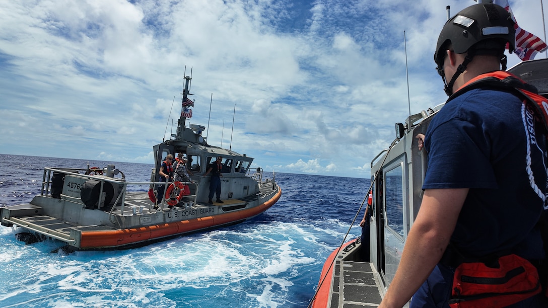 Coast Guard participants of the Quad-at-Sea Ship Observer Mission transfer between a U.S. Coast Guard Station Apra Harbor small boat and a Legend-class U.S. Coast Guard Cutter Stratton (WMSL 752) small boat to embark Stratton while the cutter patrols the Pacific Ocean, June 30, 2025. Stratton is deployed and assigned to Destroyer Squadron (DESRON) 15, the Navy’s largest DESRON and the U.S. 7th Fleet’s principal surface force. Stratton is deployed to the Indo-Pacific to advance relationships with ally and partner nations to build a more secure and prosperous region with unrestricted, lawful access to the maritime commons. (U.S. Coast Guard photo by Petty Officer 2nd Class Kate Kilroy)