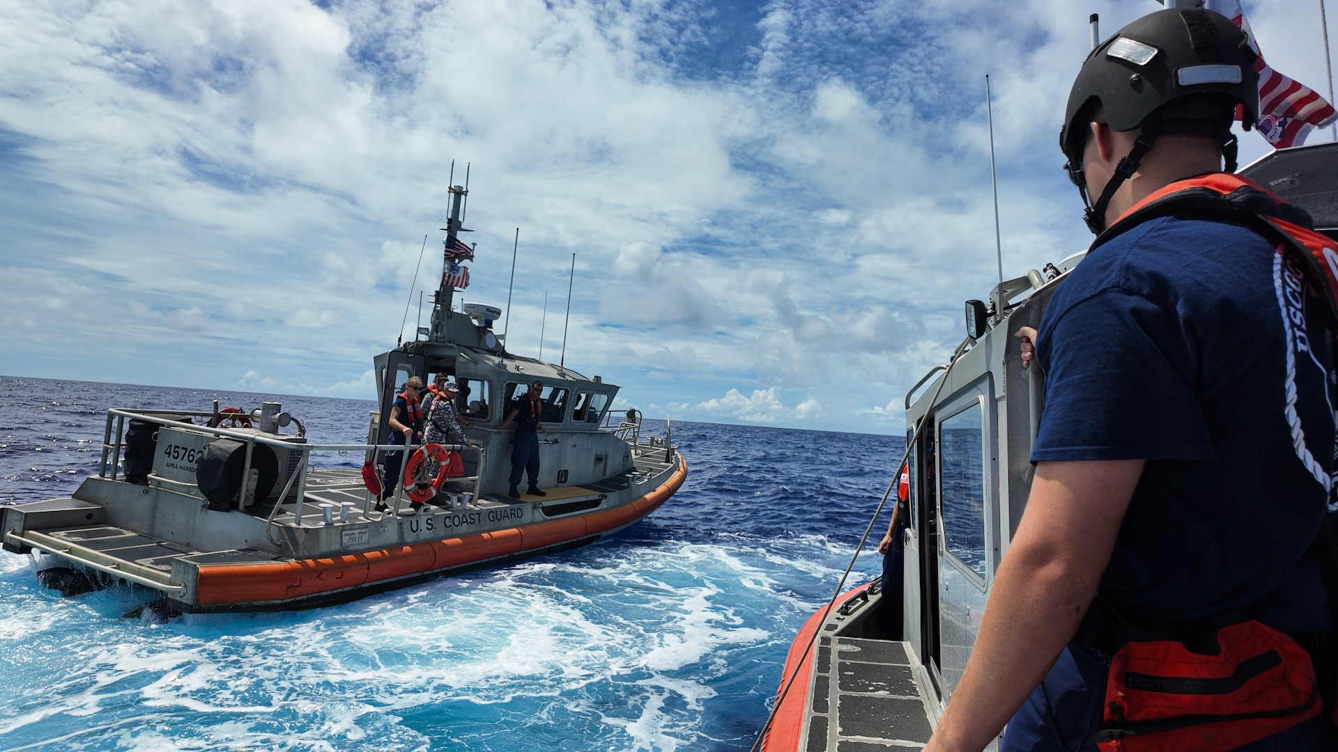 Coast Guard participants of the Quad-at-Sea Ship Observer Mission transfer between a U.S. Coast Guard Station Apra Harbor small boat and a Legend-class U.S. Coast Guard Cutter Stratton (WMSL 752) small boat to embark Stratton while the cutter patrols the Pacific Ocean, June 30, 2025. Stratton is deployed and assigned to Destroyer Squadron (DESRON) 15, the Navy’s largest DESRON and the U.S. 7th Fleet’s principal surface force. Stratton is deployed to the Indo-Pacific to advance relationships with ally and partner nations to build a more secure and prosperous region with unrestricted, lawful access to the maritime commons. (U.S. Coast Guard photo by Petty Officer 2nd Class Kate Kilroy)
