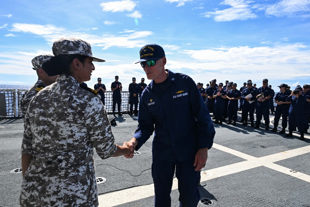 Capt. Brian Krautler, commanding officer of the Legend-class U.S. Coast Guard Cutter Stratton (WMSL 752), greets Quad ship riders from the Indian Coast Guard, while Stratton patrols the Pacific Ocean, July 1, 2025. Stratton is deployed and assigned to Destroyer Squadron (DESRON) 15, the Navy’s largest DESRON and the U.S. 7th Fleet’s principal surface force. Stratton is deployed to the Indo-Pacific to advance relationships with ally and partner nations to build a more secure and prosperous region with unrestricted, lawful access to the maritime commons. (U.S. Coast Guard photo by Petty Officer 2nd Class Kate Kilroy)