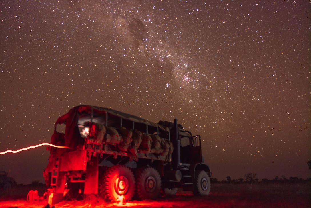 U.S. Marine Corps Cpl. Cindy Bollos, right, an ammo chief, and Lance Cpl. Jeziel Marin, a field artillery cannoneer, both with Kilo Battery, 3rd Battalion, 11th Marine Regiment, Marine Rotational Force – Darwin 25.3, fire an M777 Howitzer during Talisman Sabre 25 in the Northern Territory, Australia, July 13, 2025.