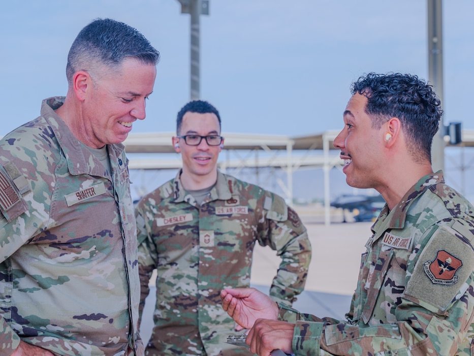 U.S. Air Force Chief Master Sgt. Jason Shaffer (left), 56th Fighter Wing command chief, accompanied by Chief Master Sgt. Derrick Chesley (center), 944th Aircraft Maintenance Squadron wing weapons manager, receives feedback from Tech. Sgt. Raul Guzman (right), 56th Maintenance Group F-35 qauality assurance inspector, after launching a jet on the flightline, July 16, 2025, at Luke Air Force Base, Arizona.