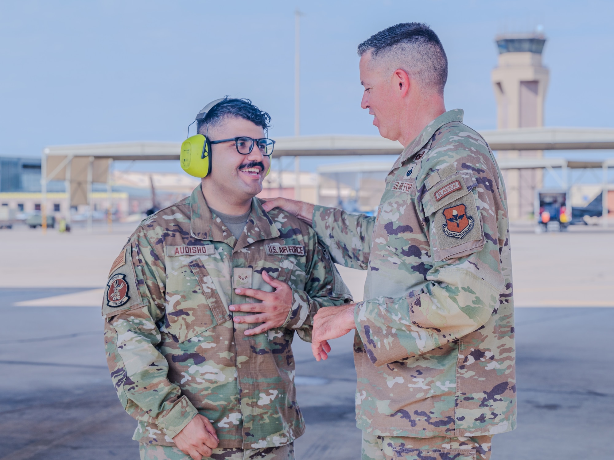 U.S. Air Force Chief Master Sgt. Jason Shaffer (right), 56th Fighter Wing command chief, speaks with Airman First Class Ninort Audisho (left), 310th Aircraft Maintenance Unit crew chief, after launching a jet on the flightline, July 16, 2025, at Luke Air Force Base, Arizona.