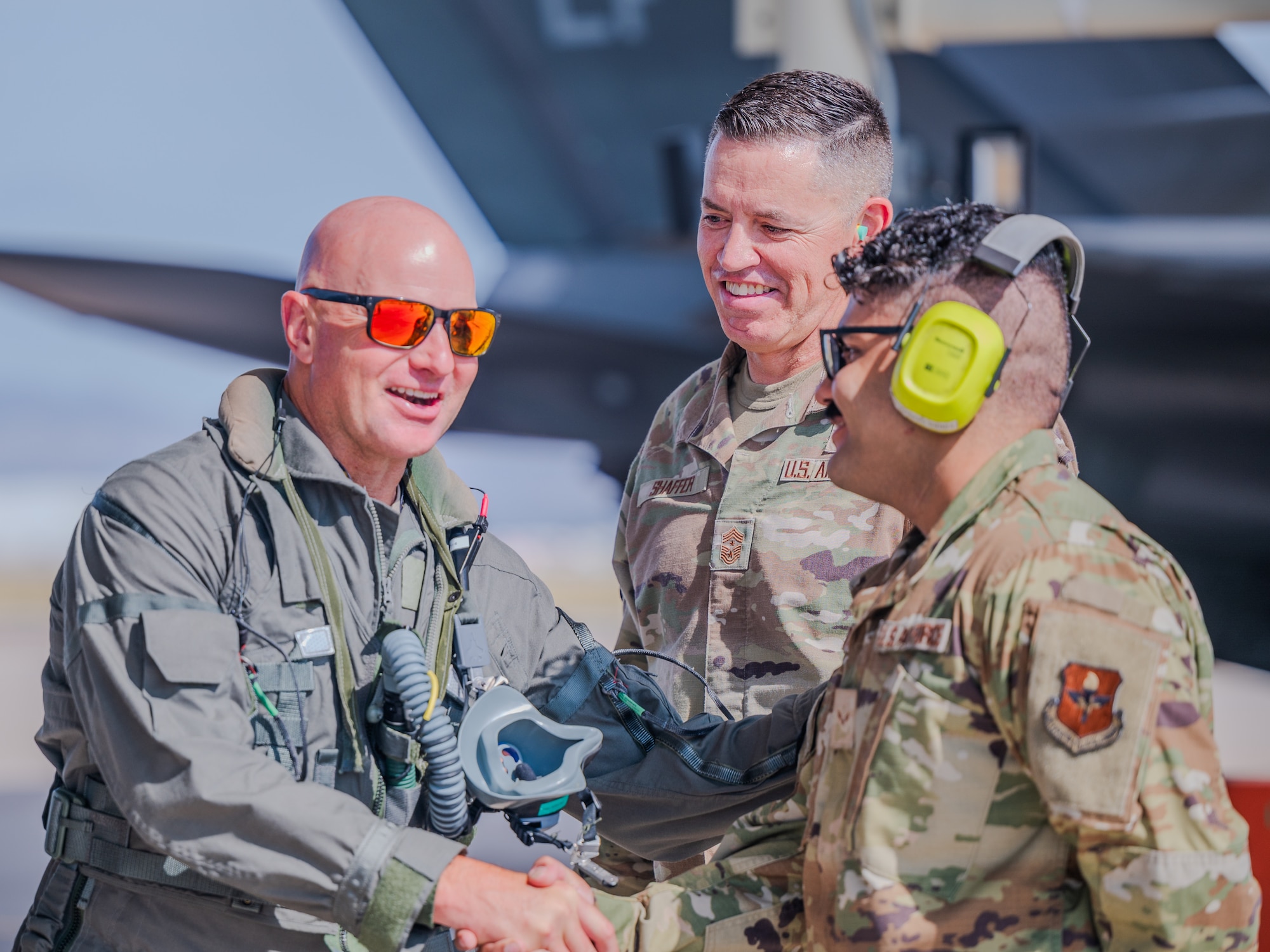 U.S. Air Force Chief Master Sgt. Jason Shaffer (center), 56th Fighter Wing command chief, and Airman First Class Ninort Audisho (right), 310th Aircraft Maintenance Unit crew chief, speak with Brig. Gen. David Berkland (left), 56th Fighter Wing commander, prior to launching his jet on the flightline, July 16, 2025, at Luke Air Force Base, Arizona.