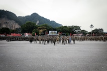 Multinational forces from the Malaysian Armed Forces, U.S. Army, and Australian Defence Force stand in formation during the opening ceremony
