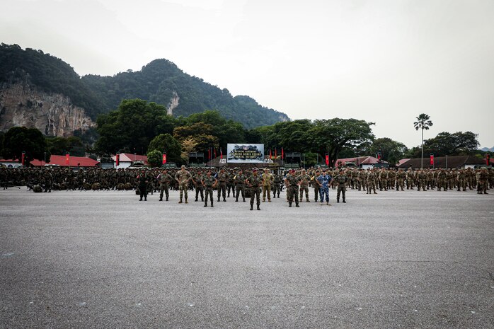 Multinational forces from the Malaysian Armed Forces, U.S. Army, and Australian Defence Force stand in formation during the opening ceremony