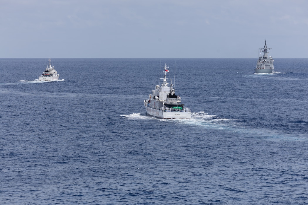 From left, the Philippine Coast Guard (PCG) Parola-class patrol vessels BRP Suluan (MRRV-4406) and BRP Cabra (MRRV-4409), and the first-in-class Philippine Navy (PN) guided-missile frigate BRP Miguel Malvar (FFG-06) steam ahead of the Arleigh Burke-class guided-missile destroyer USS Curtis Wilbur (DDG 54) during Maritime Cooperative Activity in the South China Sea, July 16, 2025.