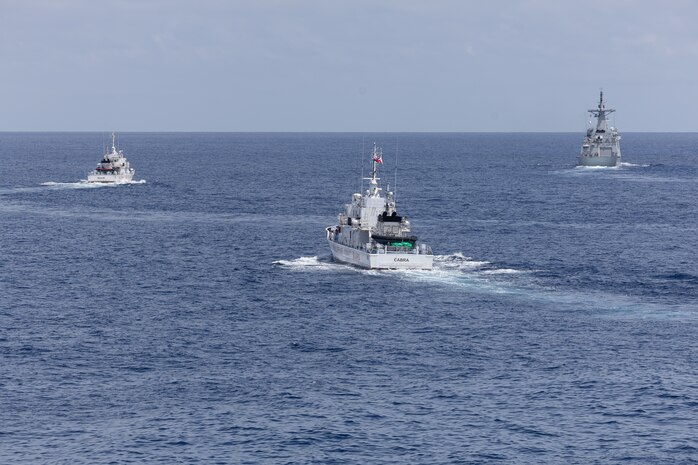 From left, the Philippine Coast Guard (PCG) Parola-class patrol vessels BRP Suluan (MRRV-4406) and BRP Cabra (MRRV-4409), and the first-in-class Philippine Navy (PN) guided-missile frigate BRP Miguel Malvar (FFG-06) steam ahead of the Arleigh Burke-class guided-missile destroyer USS Curtis Wilbur (DDG 54) during Maritime Cooperative Activity in the South China Sea, July 16, 2025.