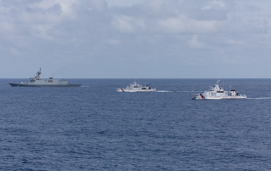 From left, the first-in-class Philippine Navy (PN) guided-missile frigate BRP Miguel Malvar (FFG-06), and the Parola-class Philippine Coast Guard (PCG) patrol vessels BRP Cabra (MRRV-4409) and BRP Suluan (MRRV-4406) steam in formation for a photo exercise with the Arleigh Burke-class guided-missile destroyer USS Curtis Wilbur (DDG 54) during Maritime Cooperative Activity in the South China Sea, July 16, 2025.
