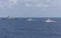 From left, the first-in-class Philippine Navy (PN) guided-missile frigate BRP Miguel Malvar (FFG-06), and the Parola-class Philippine Coast Guard (PCG) patrol vessels BRP Cabra (MRRV-4409) and BRP Suluan (MRRV-4406) steam in formation for a photo exercise with the Arleigh Burke-class guided-missile destroyer USS Curtis Wilbur (DDG 54) during Maritime Cooperative Activity in the South China Sea, July 16, 2025.