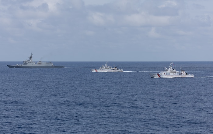 From left, the first-in-class Philippine Navy (PN) guided-missile frigate BRP Miguel Malvar (FFG-06), and the Parola-class Philippine Coast Guard (PCG) patrol vessels BRP Cabra (MRRV-4409) and BRP Suluan (MRRV-4406) steam in formation for a photo exercise with the Arleigh Burke-class guided-missile destroyer USS Curtis Wilbur (DDG 54) during Maritime Cooperative Activity in the South China Sea, July 16, 2025.