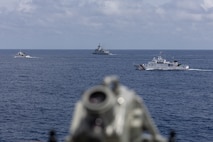 From right, the Philippine Coast Guard (PCG) Parola-class patrol vessel BRP Cabra (MRRV-4409), the first-in-class Philippine Navy (PN) guided-missile frigate BRP Miguel Malvar (FFG-06), and the Philippine Coast Guard (PCG) Parola-class patrol vessel BRP Suluan (MRRV-4406), steam ahead of the Arleigh Burke-class guided-missile destroyer USS Curtis Wilbur (DDG 54) for a photo exercise during bilateral Maritime Cooperative Activity in the South China Sea, July 16, 2025.