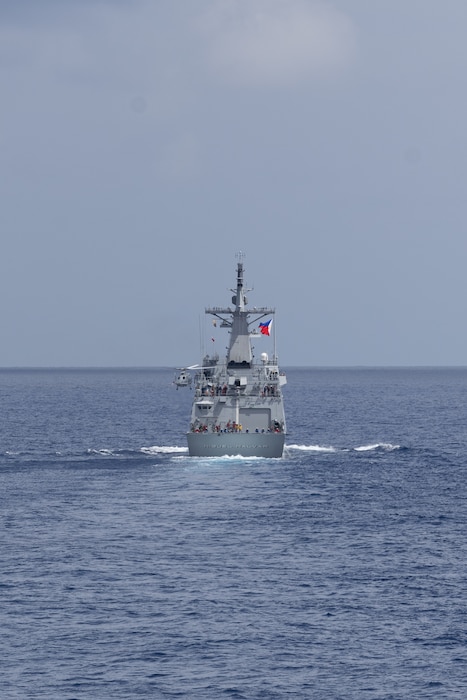 The first-in-class Philippine Navy (PN) guided-missile frigate BRP Miguel Malvar (FFG-06) conduct flight operations during a photo exercise with the Arleigh Burke-class guided-missile destroyer USS Curtis Wilbur (DDG 54) in the South China Sea, July 16, 2025.