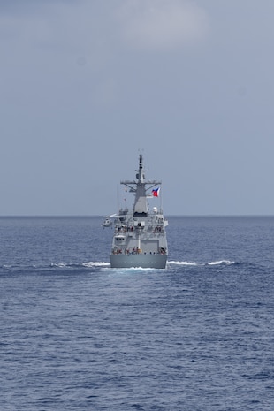 The first-in-class Philippine Navy (PN) guided-missile frigate BRP Miguel Malvar (FFG-06) conduct flight operations during a photo exercise with the Arleigh Burke-class guided-missile destroyer USS Curtis Wilbur (DDG 54) in the South China Sea, July 16, 2025.