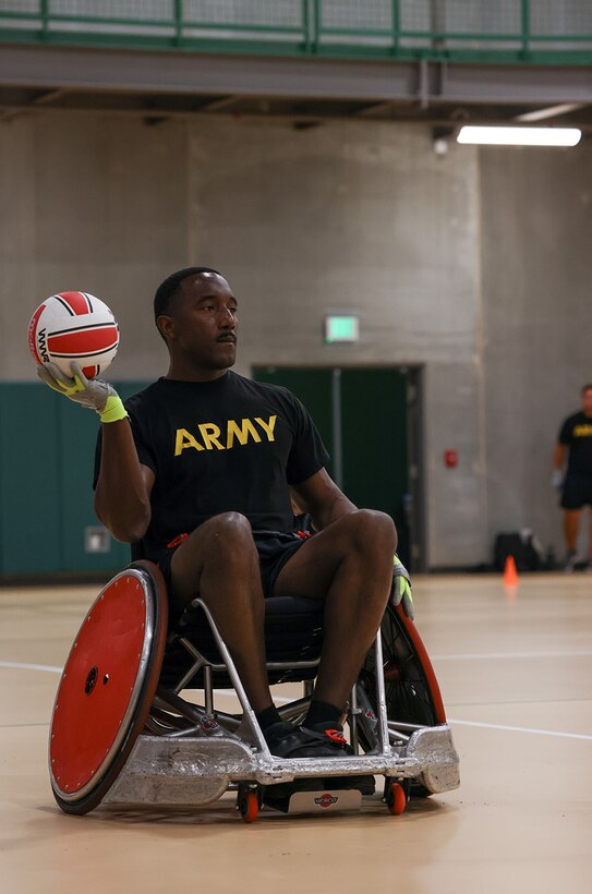 U.S. Army Master Sgt. Earlie Brown looks o throw the ball while conducting drills at wheelchair rugby practice during the 2025 Department of Defense Warrior Games practice sessions at Fort Carson, Colorado, July 14, 2025.