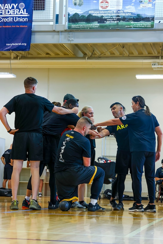 U.S. Army Volleyball Team huddle before the volleyball event, July 13, at Reid Arena, Colorado College, Colorado Springs, Colorado, during the 2025 Department of Defense Warrior Games.