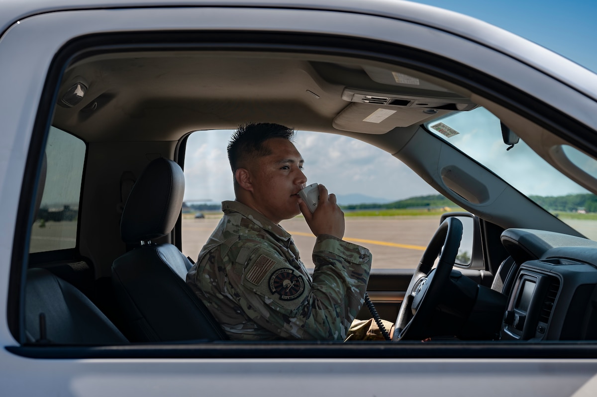 U.S. Air Force Staff Sgt. Quincy Mendoza, 35th Maintenance Squadron transient alert craftsman, uses a radio to contact the air traffic control tower during exercise Resolute Force Pacific (REFORPAC) at Misawa Air Base, Japan, July 15, 2025. The REFORPAC exercise validates Pacific Air Forces’ capacity to lead large-scale, multinational contingency operations with more than 12,000 personnel and 400 aircraft being mobilized. (U.S. Air Force photo by Senior Airman Brittany Russell)