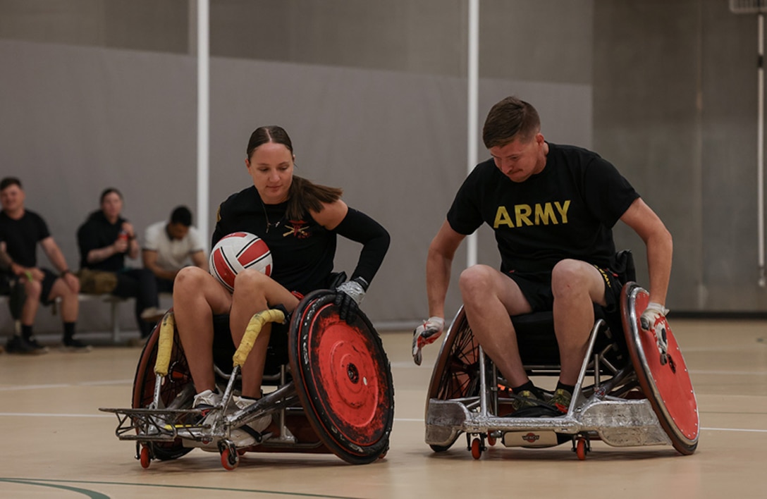 U.S. Army veteran Avery Short and Staff Sgt. Coty Tuck conduct drills at wheelchair rugby practice during the 2025 Department of Defense Warrior Games practice sessions at Fort Carson, Colorado.