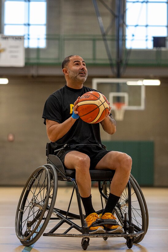 U.S. Army Capt. Carlos Rivera shoots the basketball during drills at the wheelchair basketball practice, July 14, at Reid Arena, Colorado College, Colorado Springs, Colorado, during the 2025 Department of Defense Warrior Games.
