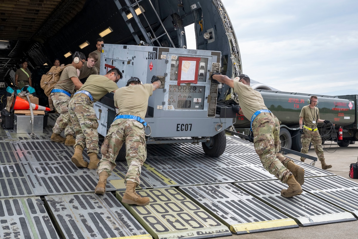 U.S. Air Force Airmen assigned to the 730th Air Mobility Squadron unload cargo from a C-5M Super Galaxy aircraft during exercise Resolute Force Pacific (REFORPAC) 2025 at Misawa Air Base, Japan, July 16, 2025.