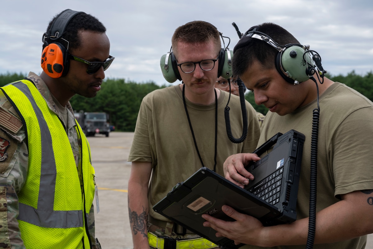 U.S. Air Force Airmen assigned to the 730th Air Mobility Squadron check aircraft information during exercise Resolute Force Pacific (REFORPAC) 2025 at Misawa Air Base, Japan, July 16, 2025.