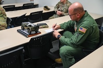 Chief Master Sgt. Jeremy Everly, 433rd Aeromedical Evacuation Squadron senior enlisted leader, takes notes during a mentoring session following an informal ceremony which designated him as the 433rd Airlift Wing’s “Jeep Chief” at Joint Base San Antonio-Lackland, Texas, July 12, 2025.