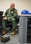 Chief Master Sgt. Jeremy Everly, 433rd Aeromedical Evacuation Squadron senior enlisted leader, receives a toy Jeep associated with the Jeep Chief tradition during an informal ceremony at Joint Base San Antonio-Lackland, Texas, July 12, 2025.