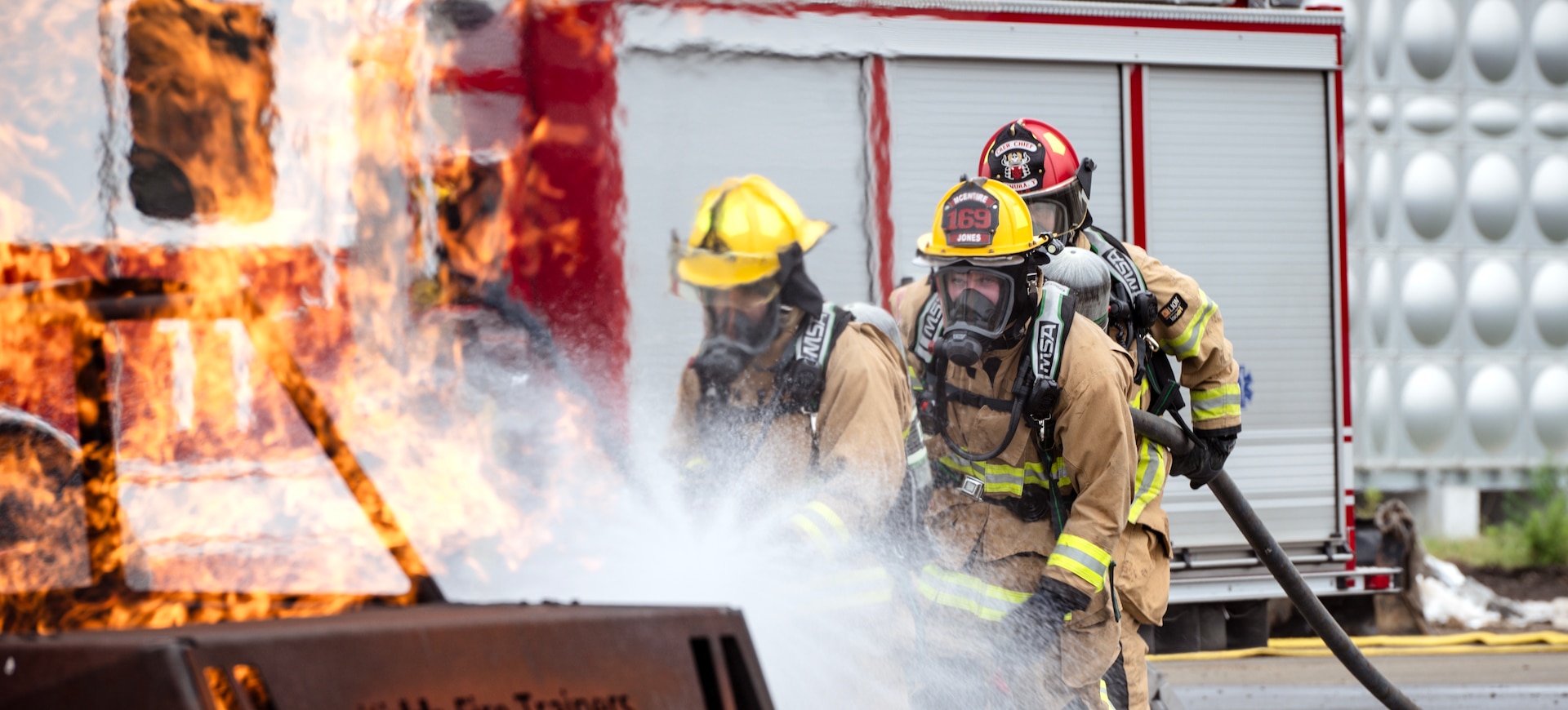 U.S. Air Force firefighters assigned to the 169th Civil Engineer Squadron’s fire department and the 374th Civil Engineer Squadron’s fire department conduct car burn procedures during a deployment for training course at Yokota Air Base, Japan, July 5, 2025.