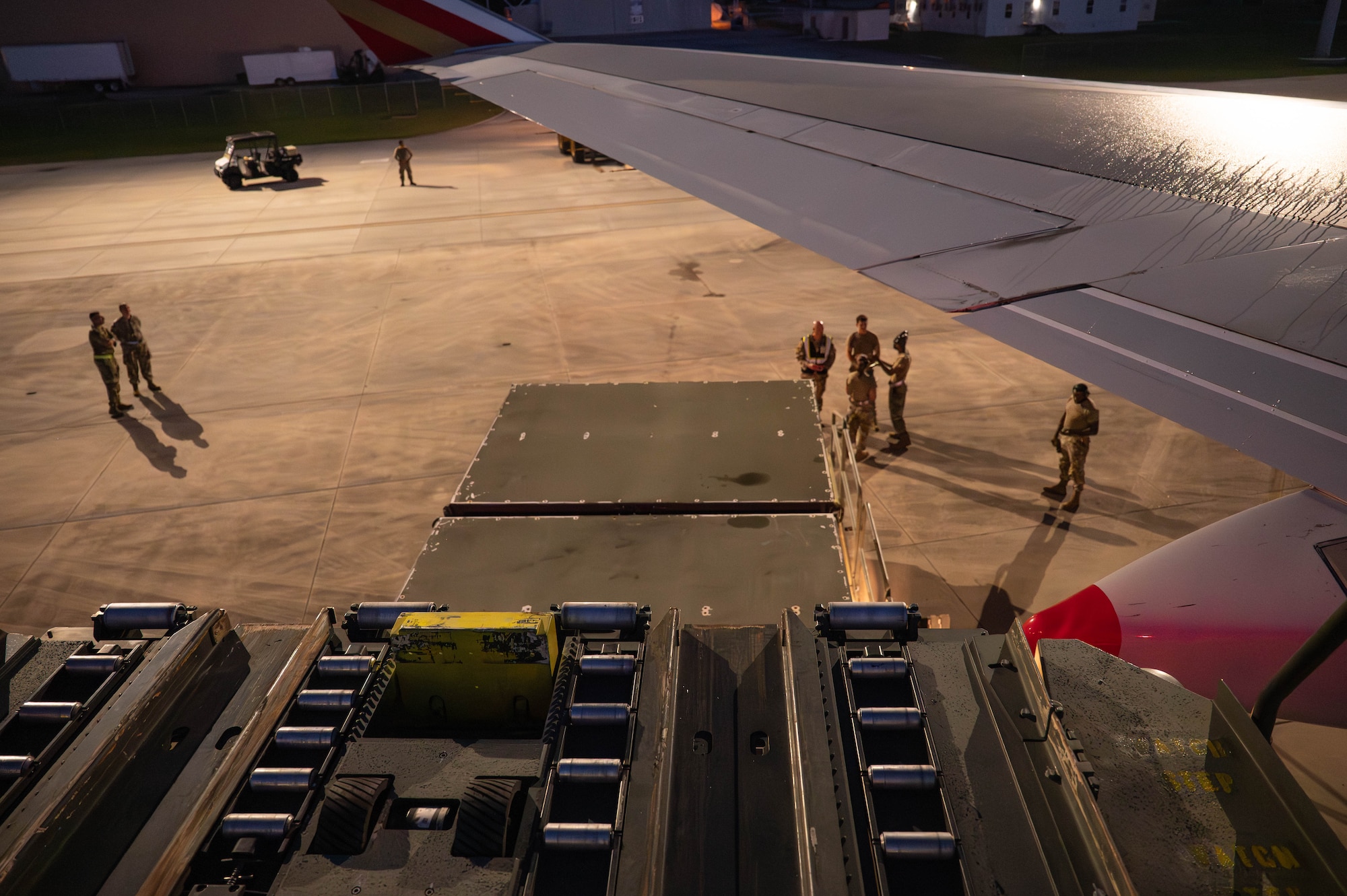 U.S. Airmen observe cargo being loaded on to a Boeing 747 aircraft
