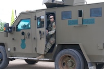 Airman 1st Class Abigail Goodner, 91st Missile Security Operations Squadron defender, checks her surroundings on Minot Air Force Base, North Dakota July 11, 2025. Goodner served as a member of the fire observers during the Bully Vigilance 25-1, an exercise designed to demonstrate the proficiency of defenders during a convoy.