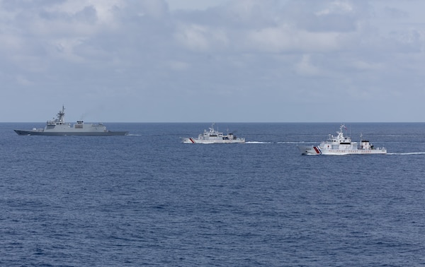 From left, the first-in-class Philippine Navy (PN) guided-missile frigate BRP Miguel Malvar (FFG-06), and the Parola-class Philippine Coast Guard (PCG) patrol vessels BRP Cabra (MRRV-4409) and BRP Suluan (MRRV-4406) steam in formation for a photo exercise with the Arleigh Burke-class guided-missile destroyer USS Curtis Wilbur (DDG 54) during Maritime Cooperative Activity in the South China Sea, July 16, 2025.