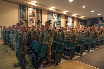 Airmen stand at attention during promotion ceremony