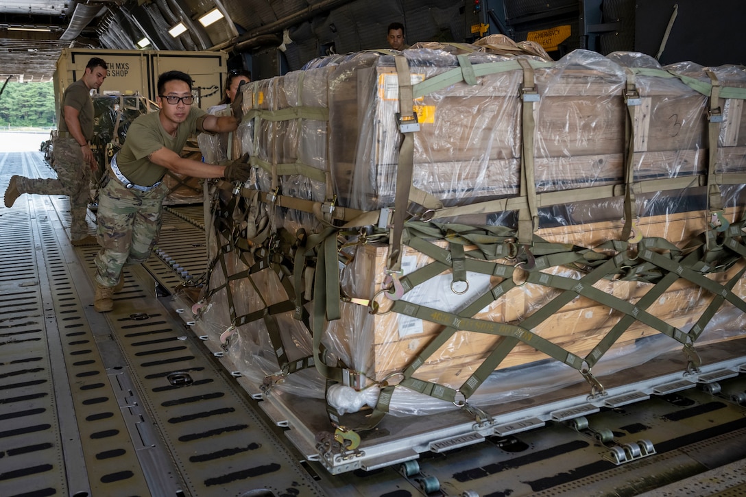U.S. Air Force Airmen assigned to the 730th Air Mobility Squadron unload cargo from a C-5M Super Galaxy aircraft during exercise Resolute Force Pacific (REFORPAC) 2025 at Misawa Air Base, Japan, July 16, 2025.