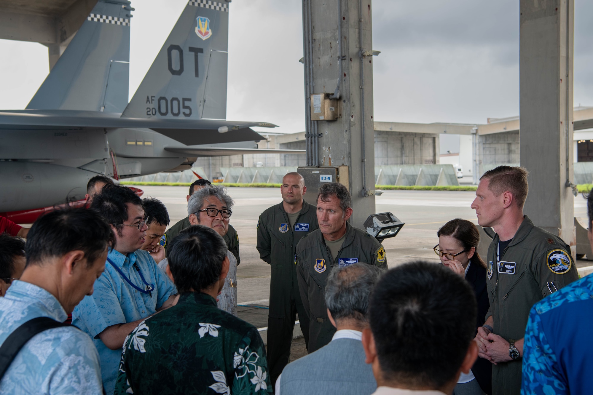 U.S. Air Force Brig. Gen. John Gallemore, 18th Wing commander, converses with Okinawan civic leaders after a tour of an F-15EX Eagle II from the 85th Test and Evaluation Squadron, Eglin Air Force Base, Florida, at Kadena Air Base, July 18, 2025.