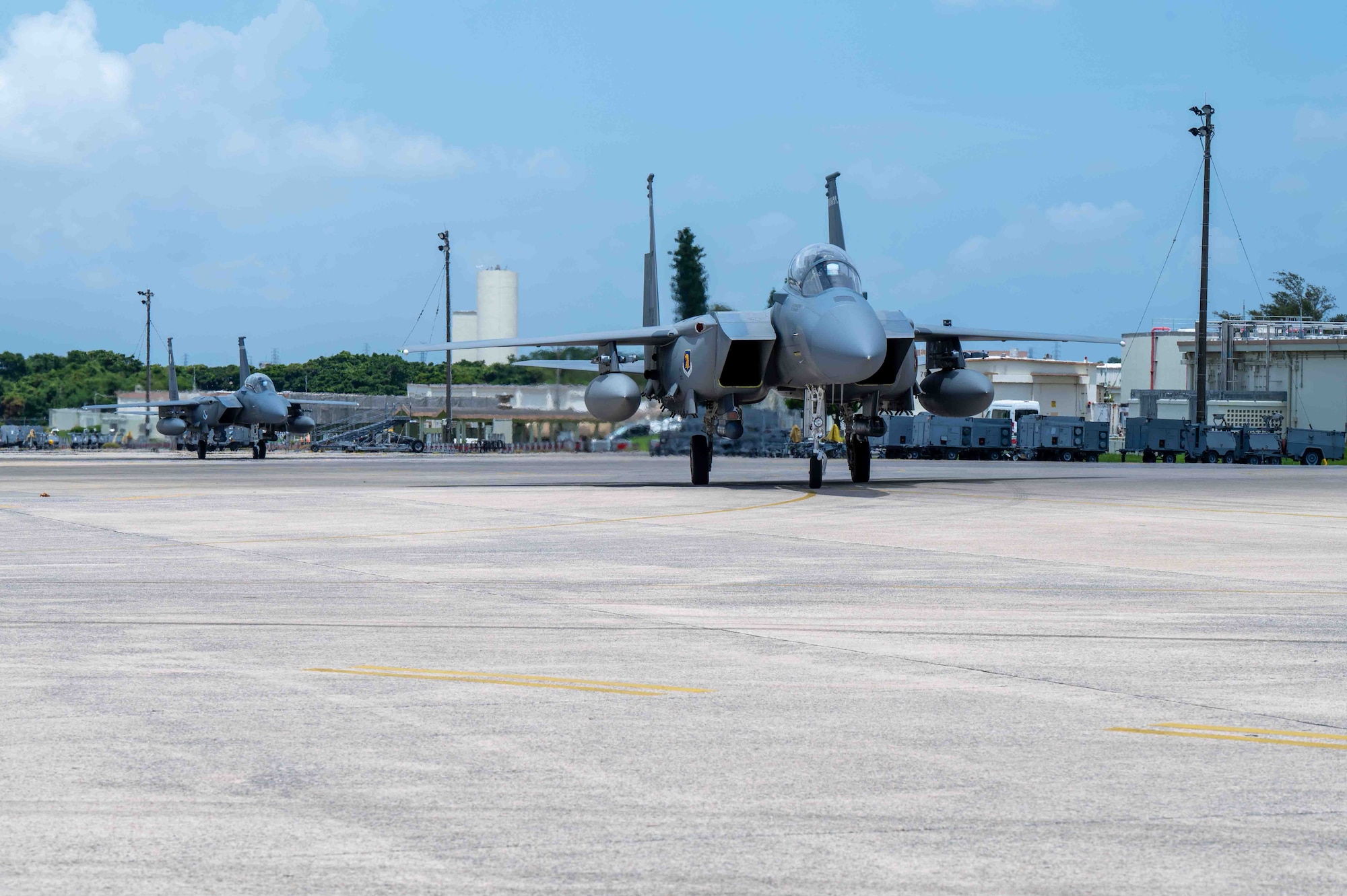 Two U.S. Air Force F-15EX Eagle IIs assigned to the 85th Test and Evaluation Squadron, Eglin Air Force Base, Florida, taxi after landing at Kadena Air Base, Japan, July 16, 2025.