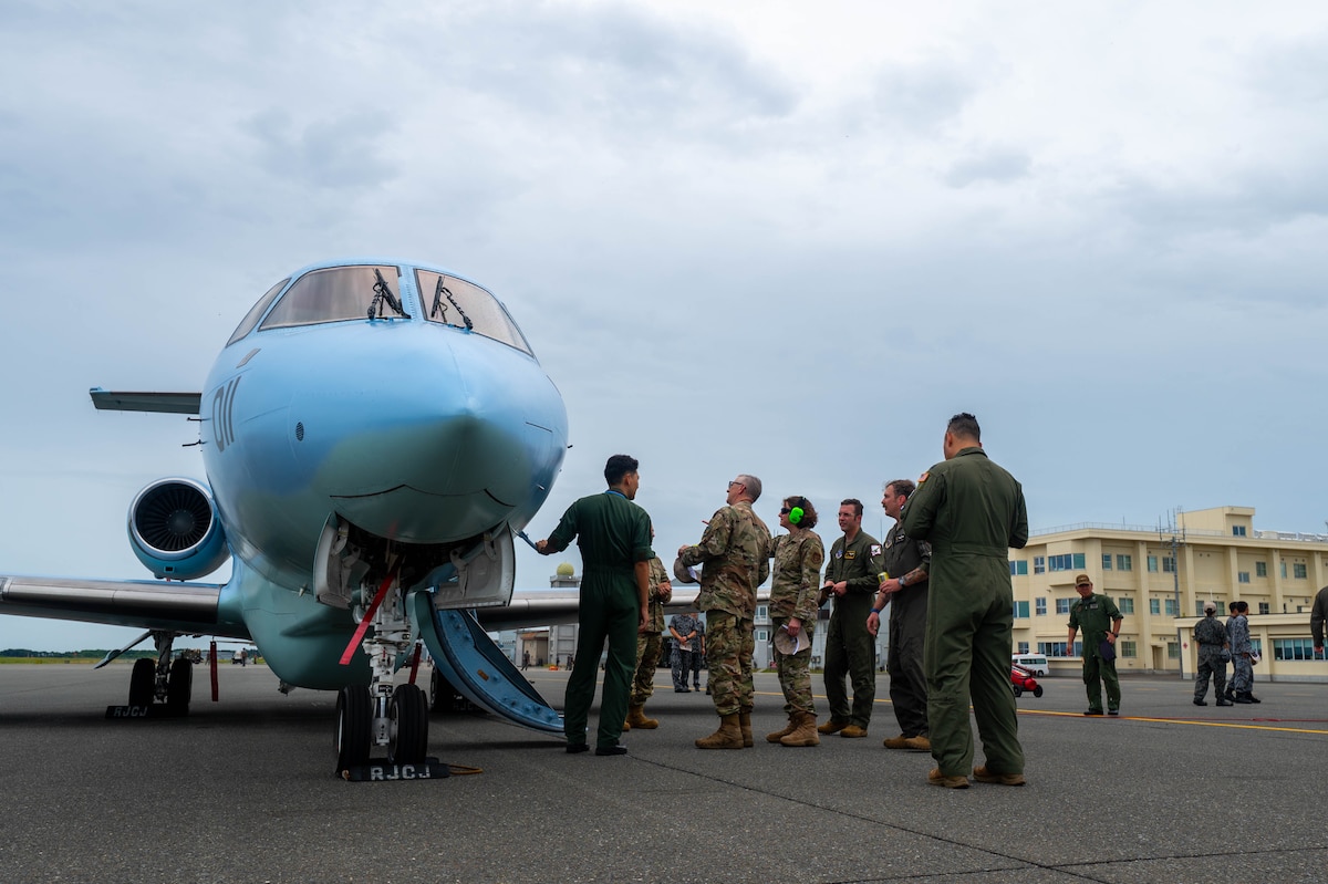 U.S. Air Force Airmen assigned to the 102nd and 130th Rescue Squadrons are shown a Japan Air Self-Defense Force Air Rescue Wing U-125A search-and-rescue coordination aircraft for a cross-unit static display and capability exchange during exercise Resolute Force Pacific (REFORPAC) at Misawa Air Base, July 15, 2025.