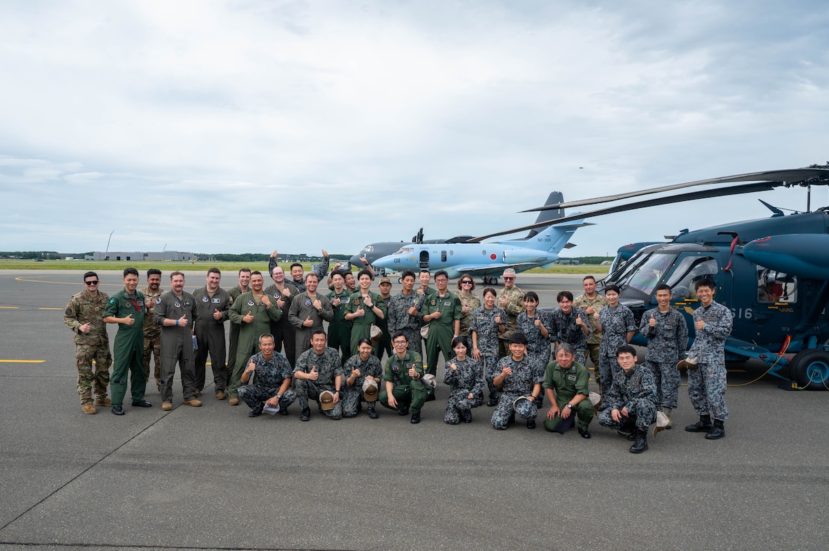 Airmen assigned to the Japan Air Self-Defense Force (JASDF) Air Rescue Wing, the U.S. Air National Guard 102nd Rescue Squadron, and the 130th Rescue Squadron participate in a cross-unit static display and capability exchange in order to strengthen combined capability during exercise Resolute Force Pacific (REFORPAC) 2025 at Misawa Air Base, Japan, July 15, 2025.